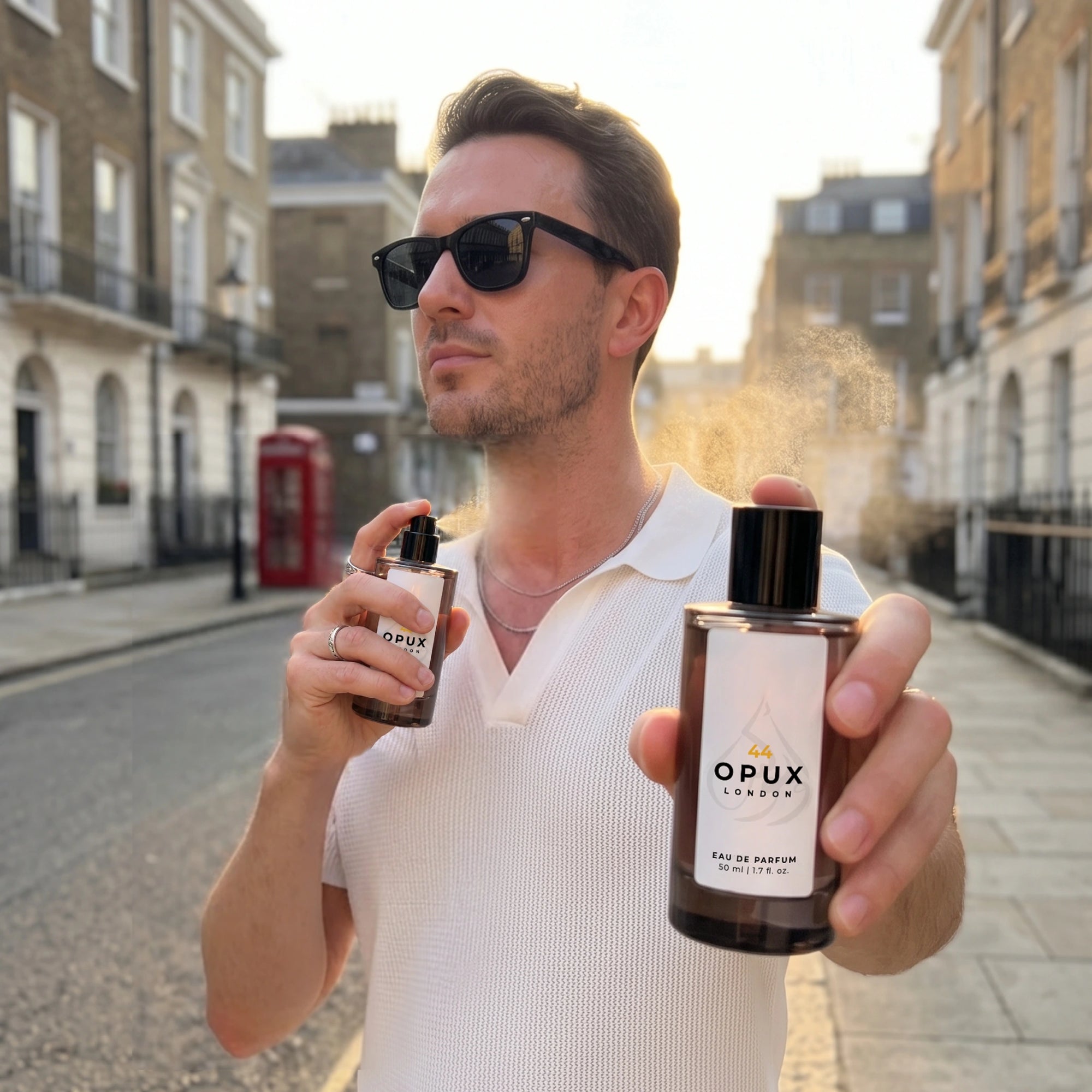 Man applying OPUX perfume outdoors