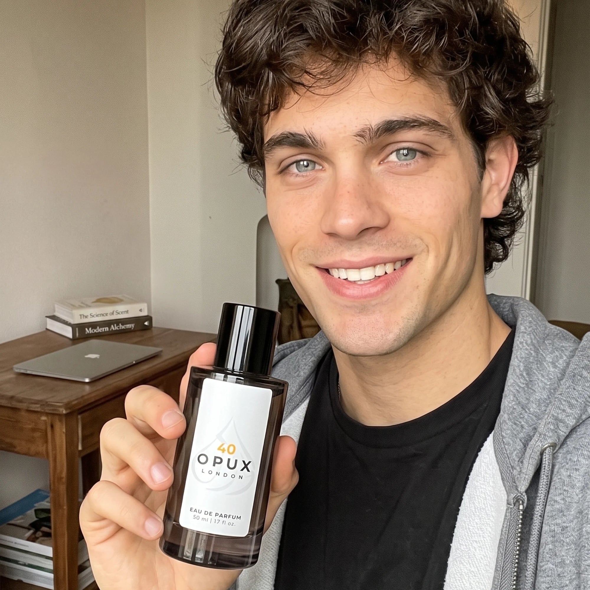 Man holding an OPUX designer inspired perfume bottle